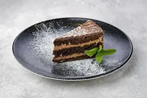 Sugar Icing Desserts Drucke: Triangular piece of chocolate cake on a plate