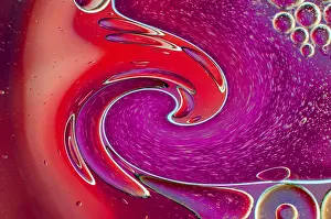 Empty Waterfront Scene Drucke: Twirling effect of bubbles on surface of water in red gradient background