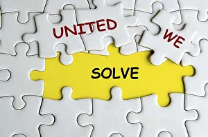 Missing Jigsaw Puzzle Drucke: United We Solve text on missing jigsaw puzzle representing teamwork and unity