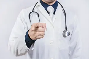 Man Looking Into The Camera Drucke: Unrecognizable doctor pointing at the camera