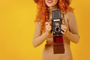 Plain Colored Background Photography Drucke: Unrecognizable redhead on a yellow background