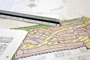 Desk Office Work Drucke: Urban development plan on a desk