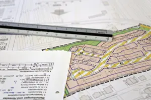 Residential Building Design Drucke: Urban development plan on a desk