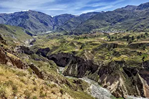 Mountainous Agricultural Landscapes Drucke: Valley with terraced fields surrounded by mountains and a river