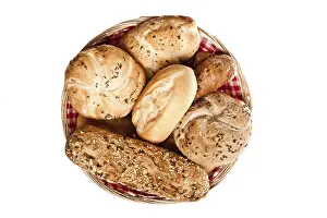 Freshly Baked Bread Drucke: Various kinds of bread in basket over white background