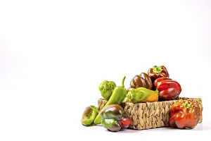 Red Green Yellow Peppers Drucke: Various peppers (Capsicum) in and next to baskets