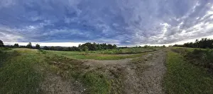 Protected Area In Germany Drucke: Vast landscape with dramatic clouds and a meandering path