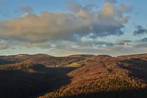 Cloudy European Scenery Drucke: Vegetation of forests and fields in the hills with clouds in evening light