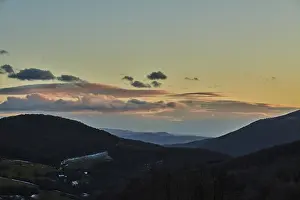 Central European Countryside Drucke: Vegetation of forests and fields in the hills with clouds in evening light