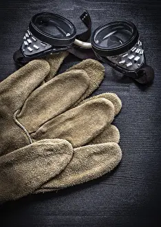 Studio Shot Details Drucke: Vertical view working goggles and protective gloves