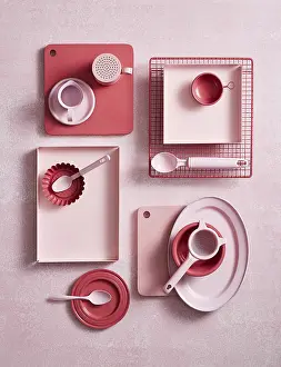 Modern Kitchen Design Drucke: Top view of an array of pink kitchen utensils and crockery on a textured surface