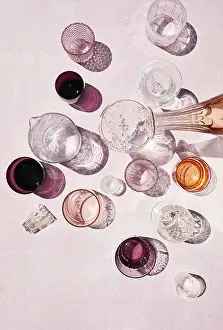 Glassware Collection Drucke: Top view of assorted beverages stylishly presented in an array of glassware on a soft pink background