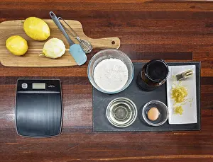 Kitchen Utensils For Baking Drucke: A top view of baking essentials on a wooden table