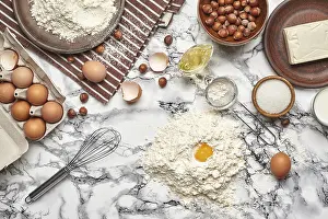 Kitchen Utensils Photography Drucke: Top view of a baking ingredients and kitchenware on a marble background