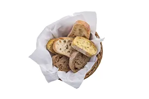 Freshly Baked Bread Image Drucke: Top view of bread in the basket isolated on white background