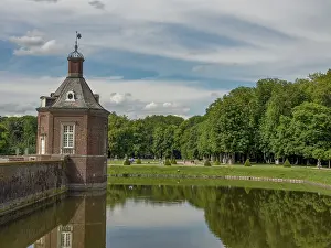 View of a castle with moat and tower