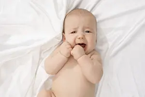 Caucasian Child Portrait Drucke: Top view of child crying while looking at camera