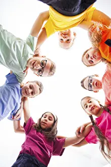 Educational Institution Photos Drucke: Below view of children embracing each other and smiling at camera