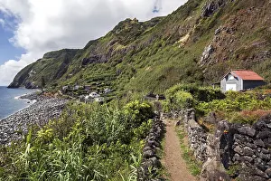 Uninhabited Coastal Area Europe Drucke: View of cliffs and settlement Rocha da Relva