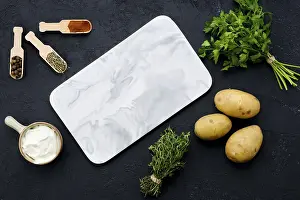 Food Photography Composition Drucke: Top view of composition with marble serving board and ingredients for cooking