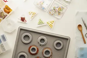 Studio Photography Equipment Drucke: Top view of a creative jewelry making setup in a studio with tools like scissors