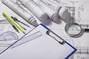 Construction Plan Drucke: View on drawing tools with blueprints