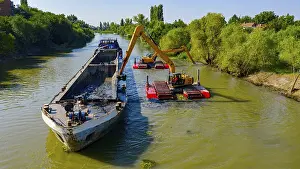 Archeological Excavation Site Drucke: Above view on two excavators dredge as they dredging