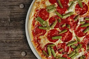 Top View Of Pizza Slice Drucke: Top view of half of pizza pepperoni
