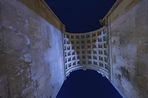 Dark European Landscape Drucke: View through a high arcade into the night sky with grid structure
