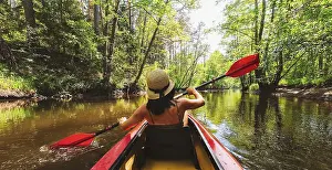 Water Sports Activity Drucke: Back view Kayaking couple in river