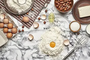 Marble Table Background Drucke: Top view of a kitchenware and baking ingredients on a marble table background