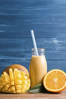 Citrus Fruit Juice Recipe Drucke: Front view mango orange smoothie