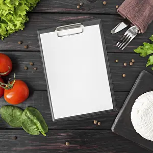 Deserted Kitchen Table Setup Drucke: Top view empty menu with tomatoes spinach