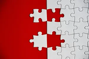 Handicraft Symbolism Drucke: Top view of missing jigsaw puzzle on red cover background