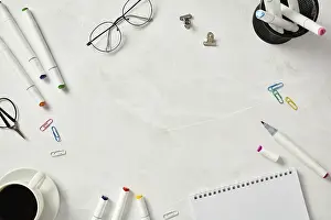 Home Office Organization Drucke: Top view of an organized creative workspace setup featuring a sketchbook