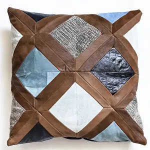 Isolated White Studio Background Drucke: Top view of patchwork leather decorative pillow on white background