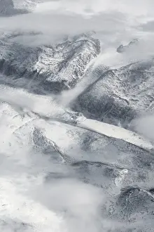 Snow Covered Mountain Range Drucke: View from the plane on glacier