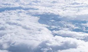 View From Airplane Window Drucke: View from the plane onto a sea of clouds