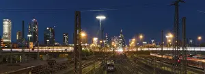 Central Europe Cityscape Photography Drucke: View over rails and moving train to the main station