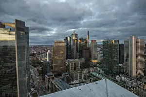 View Over The City At Sunset Drucke: View of the skyline from a tower block in the evening