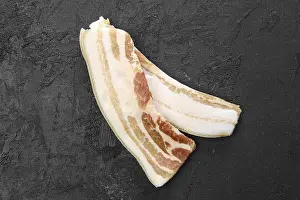 Close Up Bacon Drucke: Top view of two slices of bacon on the table
