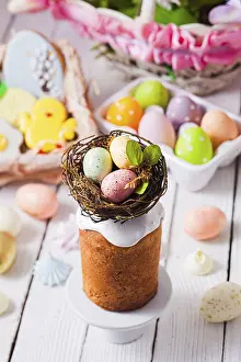 White Wooden Background Drucke: Top view small Easter cake decorated with nest and tiny eggs