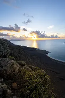 Steep Coastline At Sunset Drucke: View of steep cliffs on sea and coast