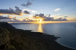 Steep Coastline At Sunset Drucke: View of steep cliffs on sea and coast