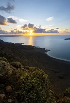 Steep Coastline At Sunset Drucke: View of steep cliffs on sea and coast