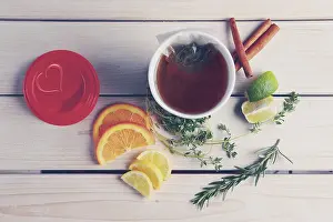 Organic Product Nutrition Drucke: Top view of table with herb tea with orange