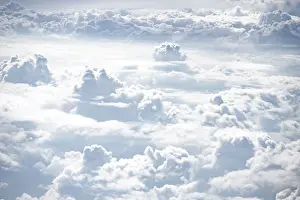 Aerial View Drucke: View over towering clouds, cloudy sky