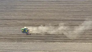 Field Work And Cultivation Drucke: Above view of tractor as pulling machine