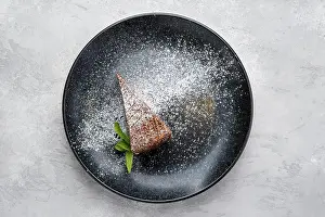 Dark Chocolate Dessert Drucke: Top view of triangular piece of chocolate cake on a plate