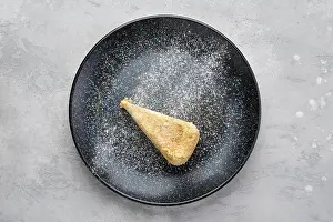 Napoleon Cake Drucke: Top view of triangular piece of classic Napoleon cake on a plate
